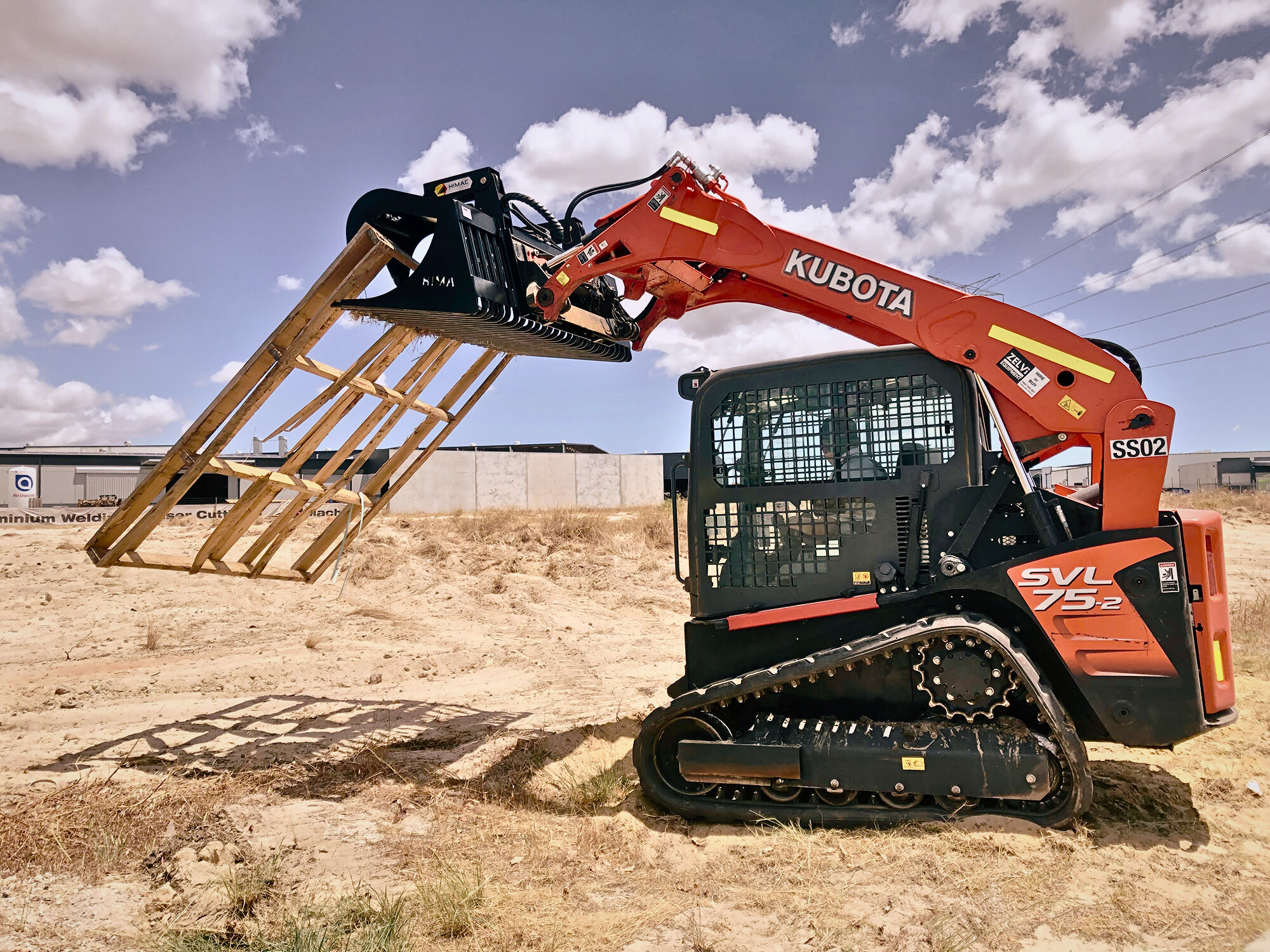 Skid Steer Performing Site Levelling on Construction Ground