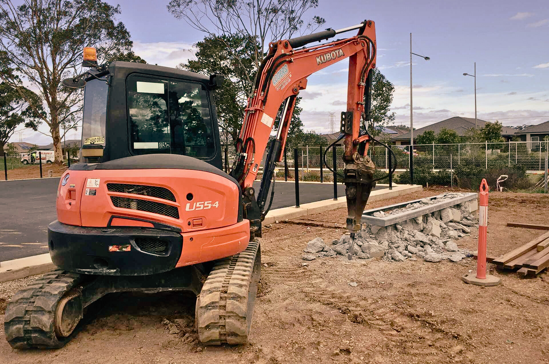 An excavator from Dynamic Earth Solutions performing swimming pool excavation.